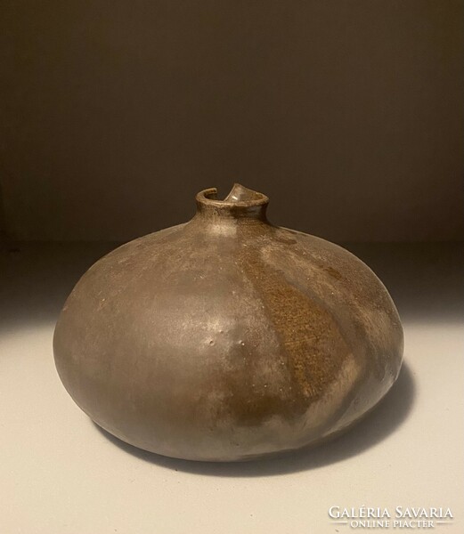 Industrial artist's fiber sphere vase with decorative liquid brown glaze