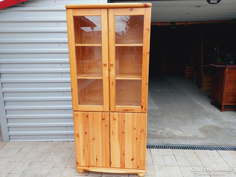 A 2-door claudia pine display case for sale. Rs furniture furniture in nice, new condition.