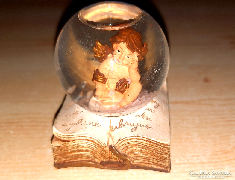 Old glass sphere with an angel