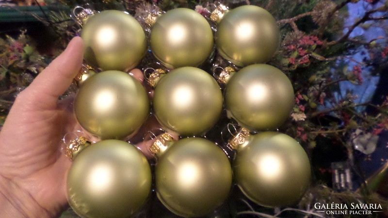 9 never used, 6 cm, glass Christmas tree decorations in one. They are light green.