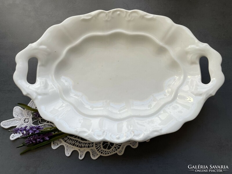 Old, large white porcelain serving bowl with handle, table centre