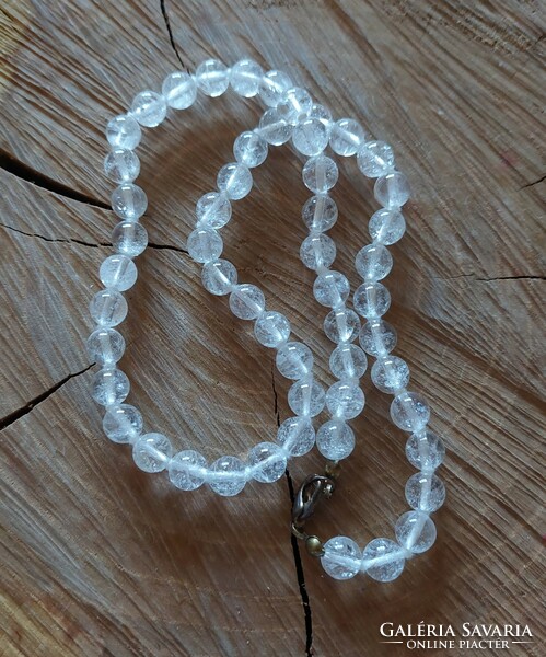 A beautiful rock crystal necklace, knotted by eye
