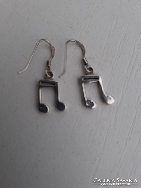 Marked sterling silver hook-and-loop earrings with a musical note pendant, studded with stones, in good condition