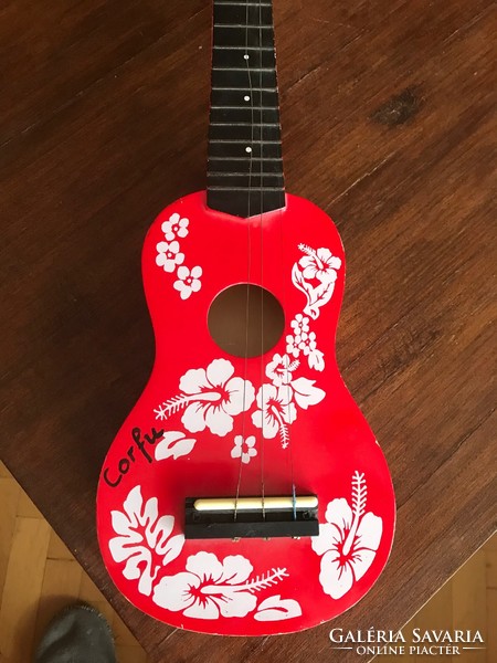Gyerek játék gitár. Piros színben. Mérete: 51x16 cm