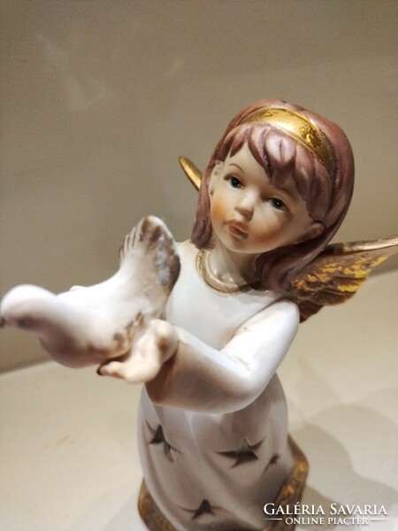 Angel with dove, candlestick