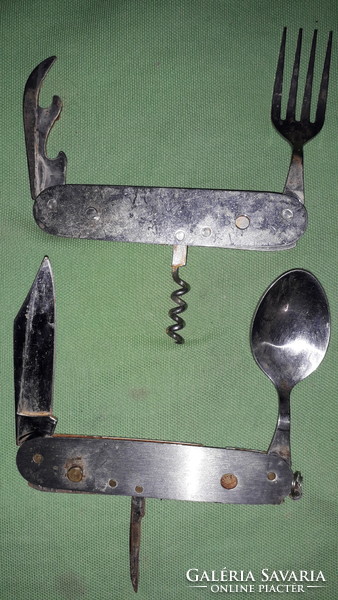 Two Swiss multi-functional steel knives as shown in the pictures