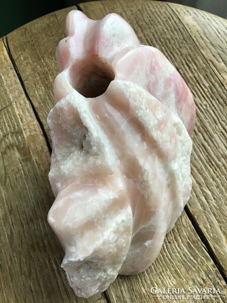 Old carved rose quartz perhaps? Mineral candle holder