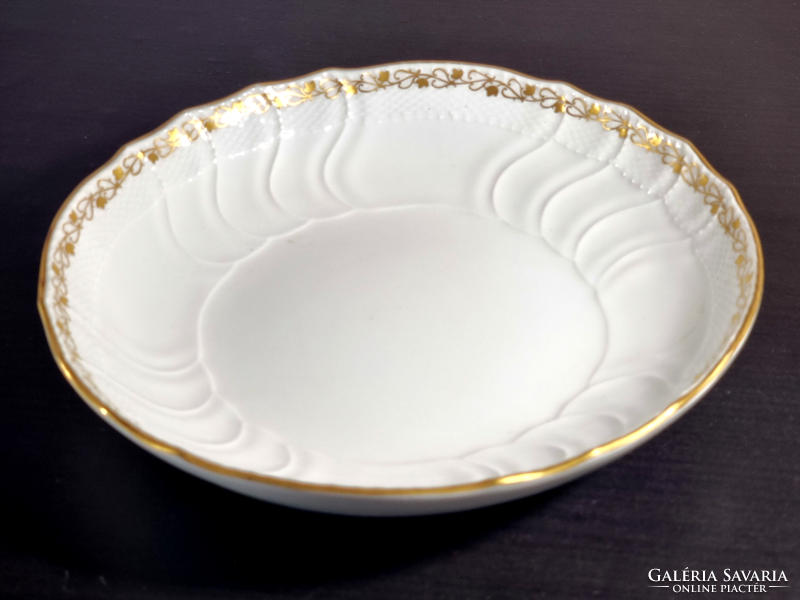 *Kpm Berlin porcelain plate, decorated with a gilded border, around the middle of the 19th century.
