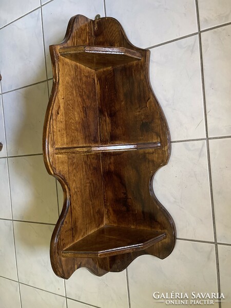 Large, heavy, solid, easy-to-use, carved wooden corner shelf.