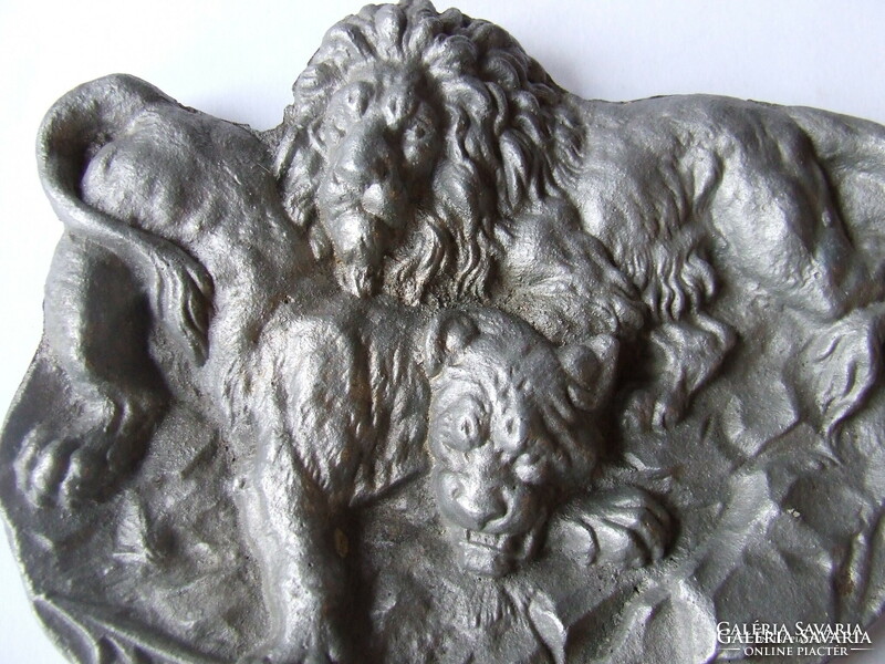 Old aluminum business card holder with lion decoration, relief