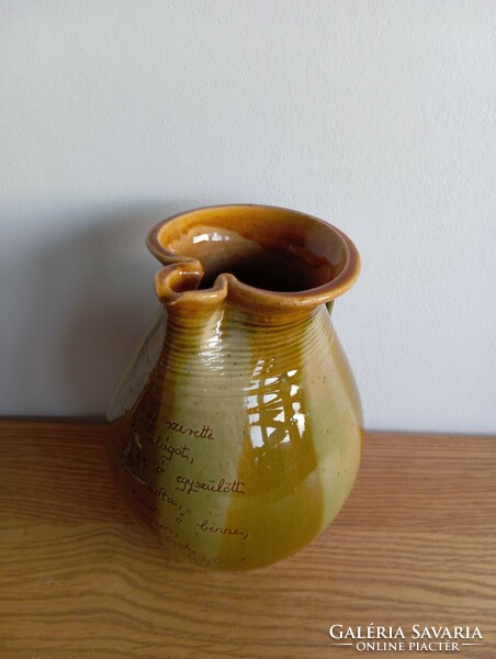 Folk ceramic jug with a biblical quote.