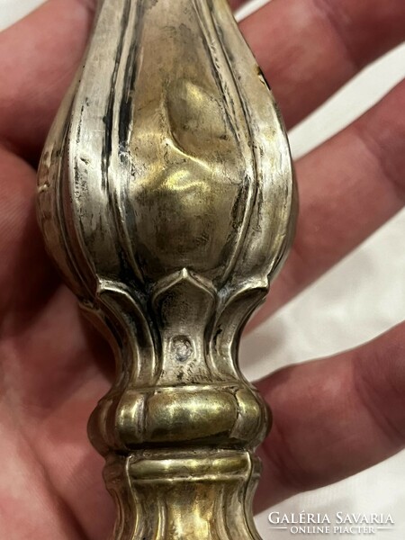 Silver candle holder. In bad condition.