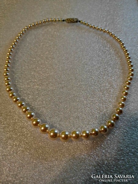 String of pearls with a beautiful marked clasp