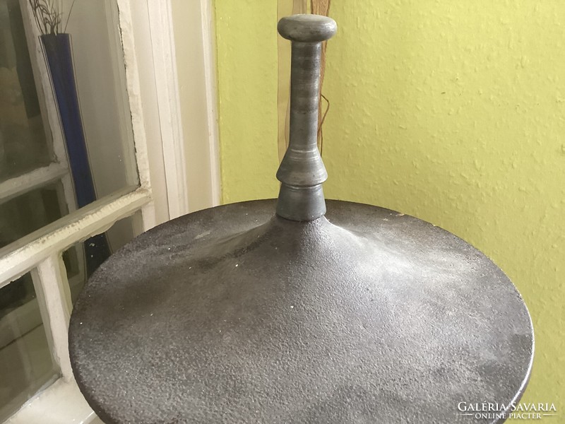 Old antique cylindrical iron stove