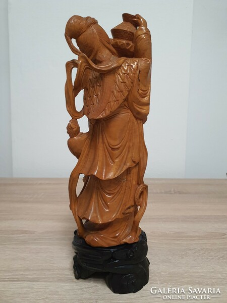 Oriental carved statue depicting a Geisha.