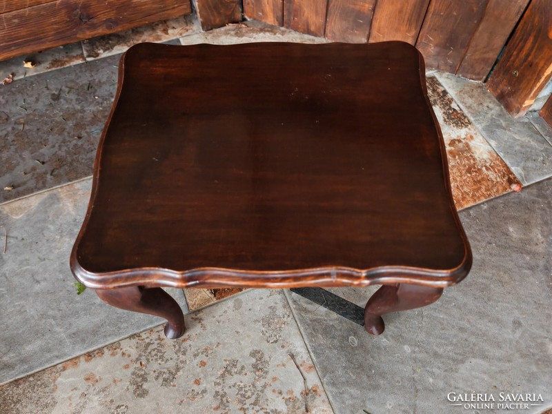 Small wooden table in neobaroque style