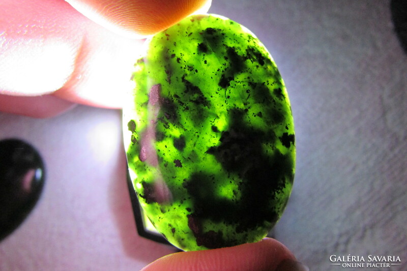 Made with unique craftsmanship, on a gem-quality serpentine cabochon, which is considered world rarity