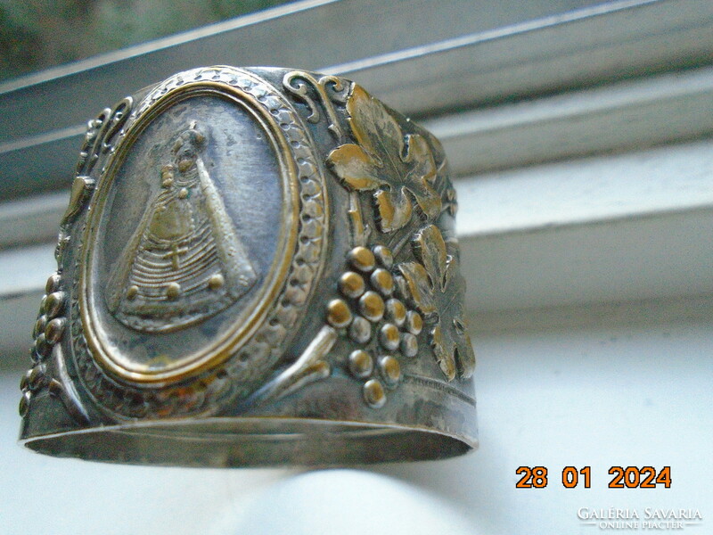 Répoussé silver-plated copper napkin ring with Mary baby Jesus and rich grape decoration