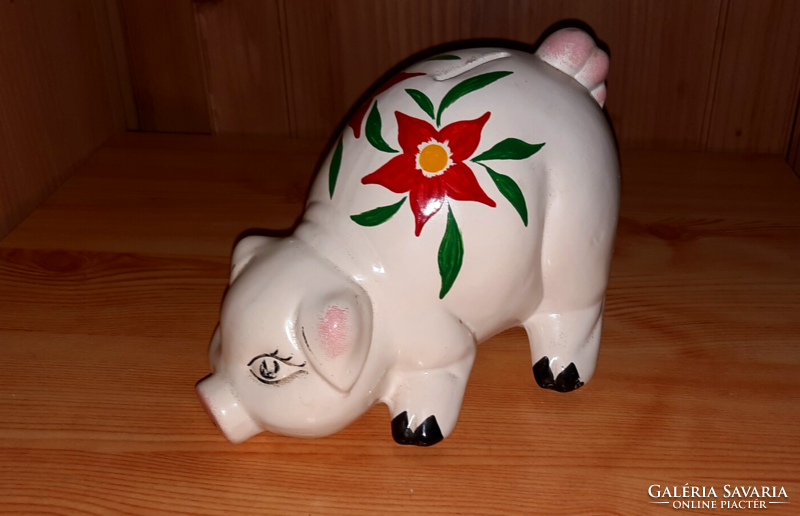 Old ceramic piggy bank with flower pattern