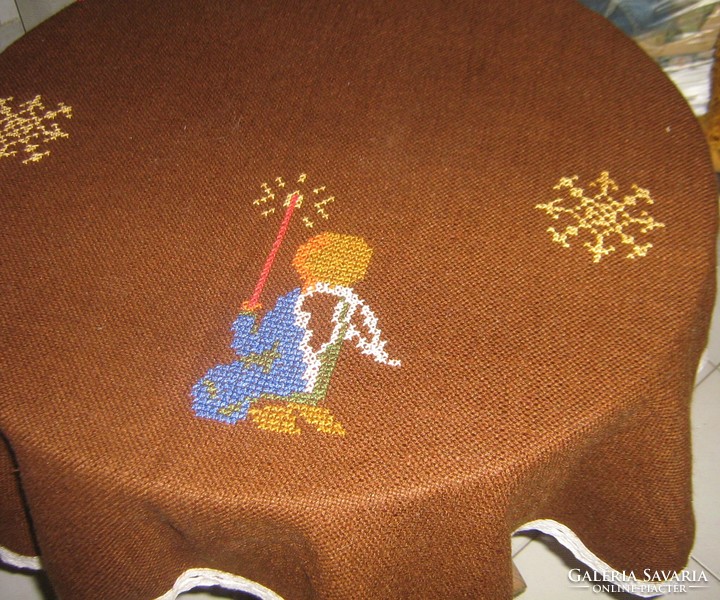 Beautiful hand-embroidered Christmas oval woven tablecloth with a lace edge