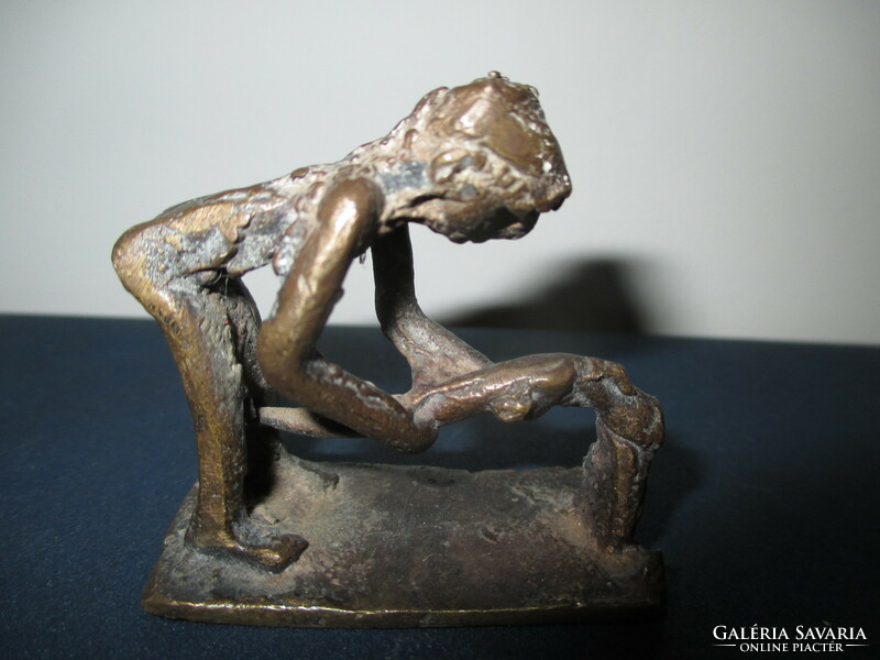 A small amorphous bronze statue