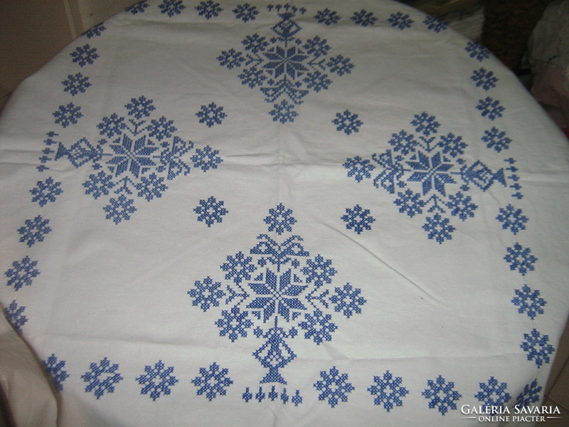 Beautiful blue floral tablecloth embroidered with cross stitches