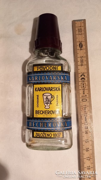 Small becherovka bottle with an old vinyl cap