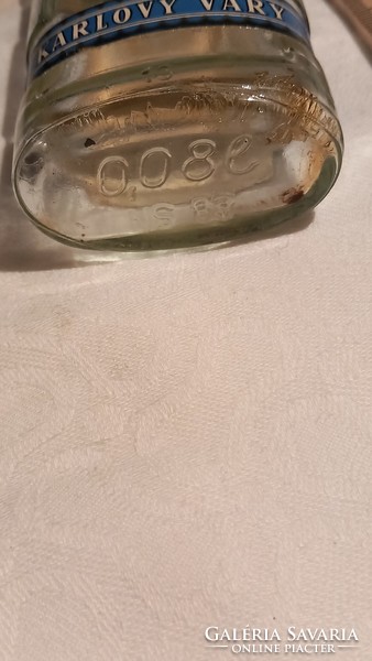 Small becherovka bottle with an old vinyl cap