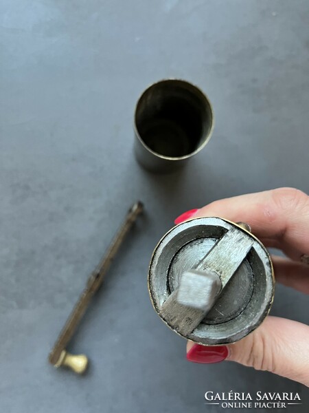 Old copper coffee grinder with oriental mark