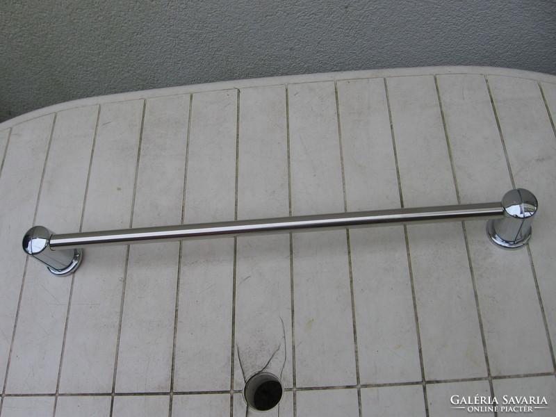 Silver colored towel rack
