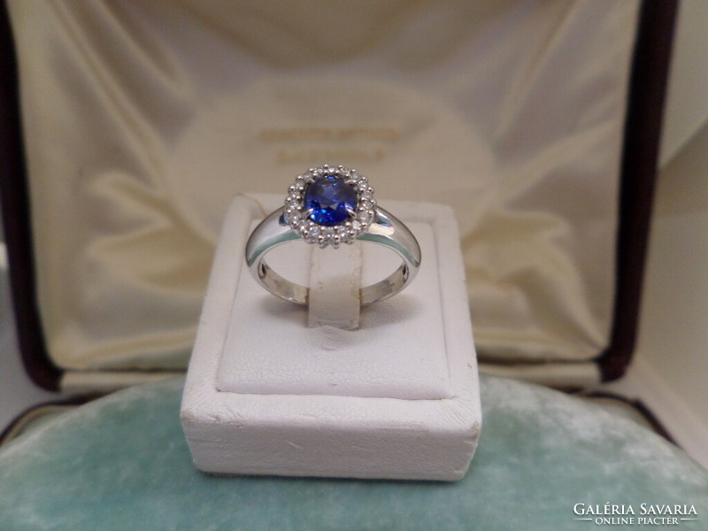 White gold ring with beautiful colored blue sapphires and brilliants
