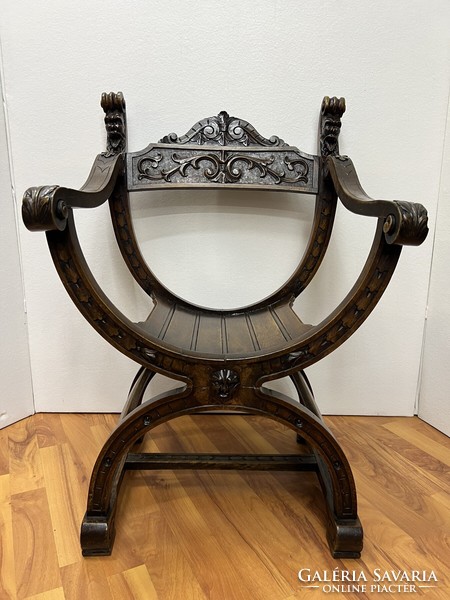Antique carved Savonarola armchair