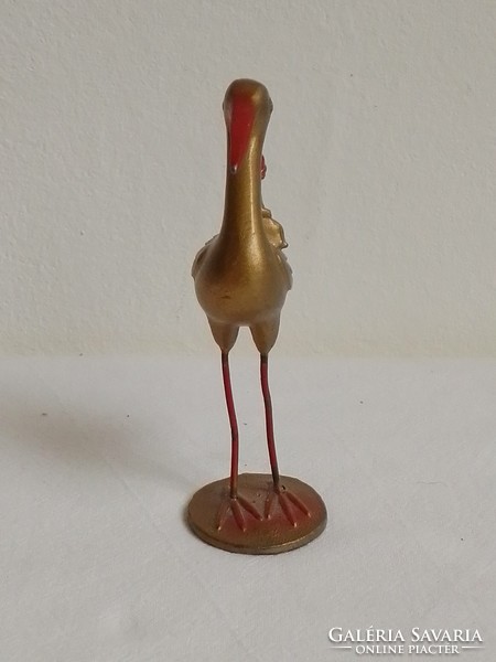 Antique old lead statue figure painted gold, stork with small child, baby shower gift, 9.5 cm