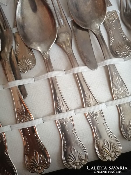For sale is a 12-piece thick silver-plated dinner set in its own box