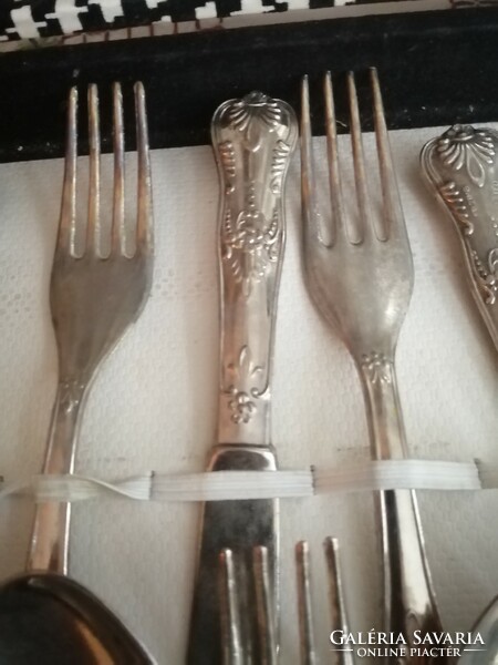 For sale is a 12-piece thick silver-plated dinner set in its own box