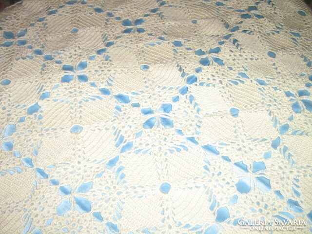 Beautiful hand crocheted tablecloth lined with blue silk