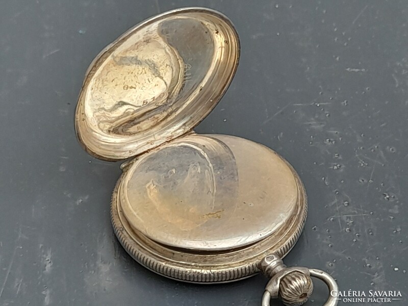 Non-functioning silver pocket watch