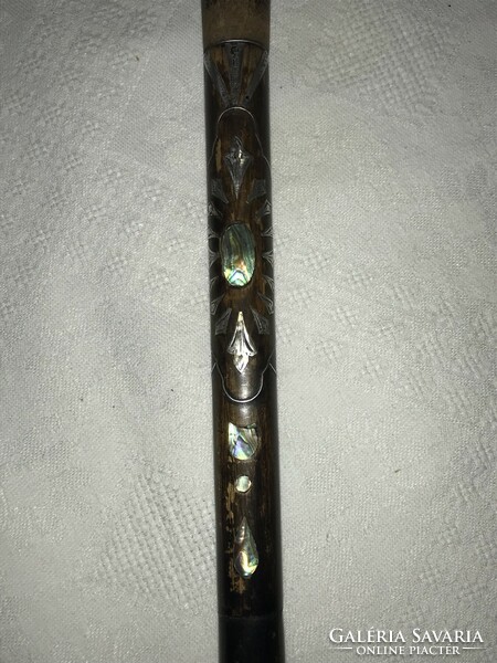 A walking stick with a beautiful ball end, shell pearl case, silver inlay