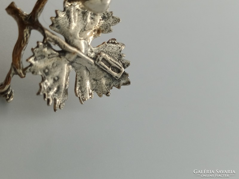 Silver figure, grapes