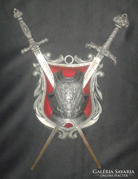 Knight's breastplate with swords. Decorative object that can be hung on the wall