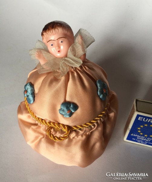 Old silk sewing, toiletry or jewelry box decorated with a smaller hard plastic doll