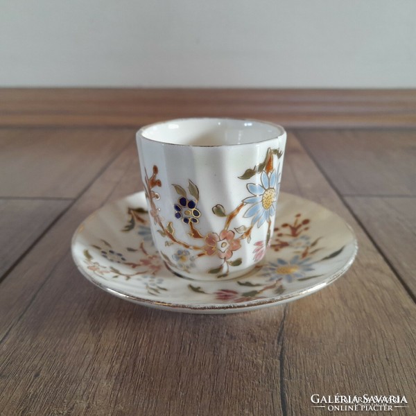 Antique Zsolnay cup with floral pattern