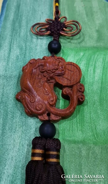 Real room. Feng shui rosewood pendant, amulet, material protection