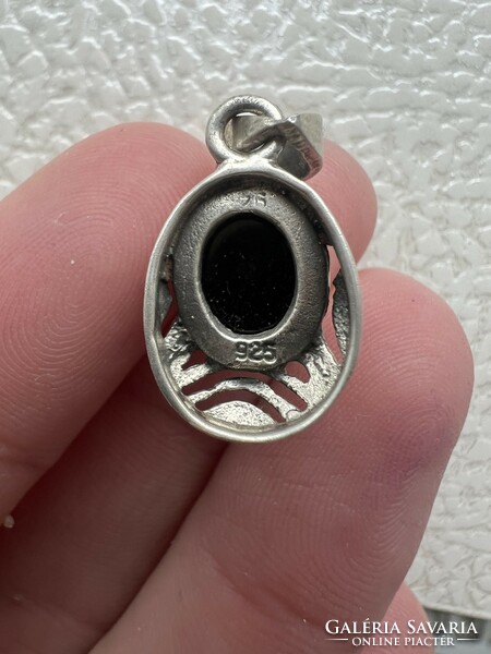 Antique silver pendant with amber stone