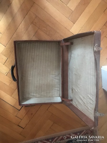Suitcase, suitcase, decorated with leather edges. It is made of very 