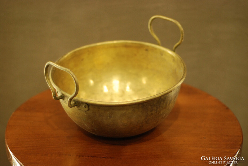 Yellow copper cauldron in patina condition