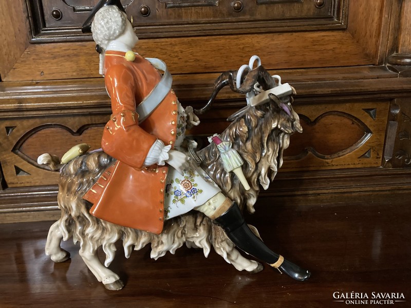 A master tailor riding a goat