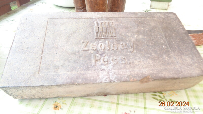 Zsolnay fired ceramic brick with the factory mark on it