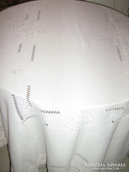 Beautiful hand-crocheted embroidered white tablecloth with a lace edge