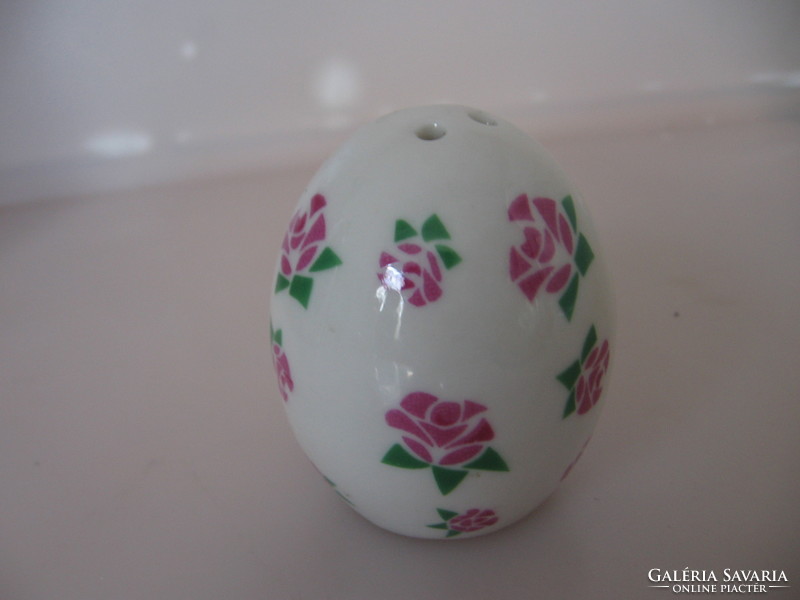 Egg-shaped porcelain salt shaker with a rose pattern